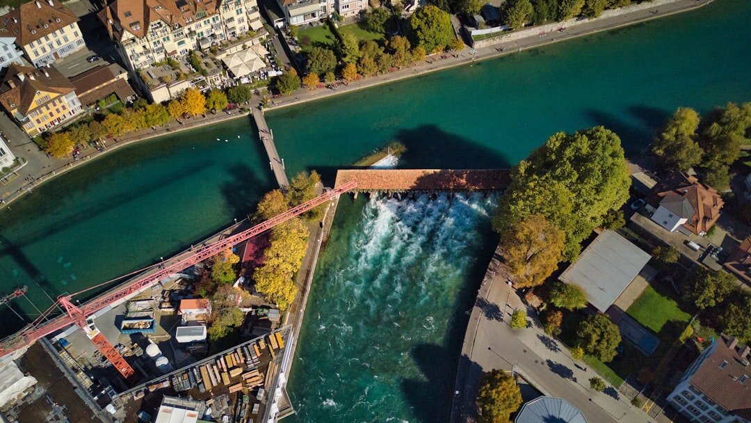 Aerial view of a Swiss river flowing past an industrial site